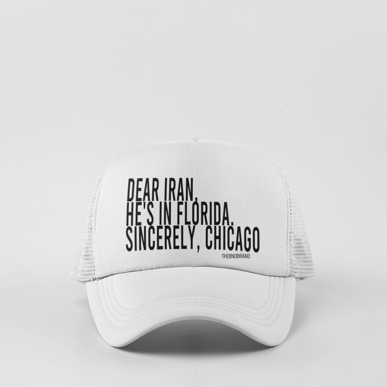 White cap with black text on a light gray background