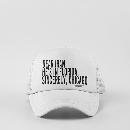 White cap with black text on a light gray background